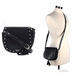 Victoria’s Secrets crossbody black purse with studs and tassel. Adjustable strap